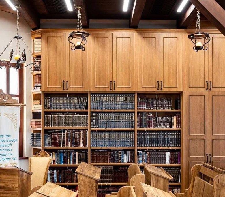 Restored wooden bookcases lining the wall of the Baal Shem Tov's synagogue in Medzhybizh